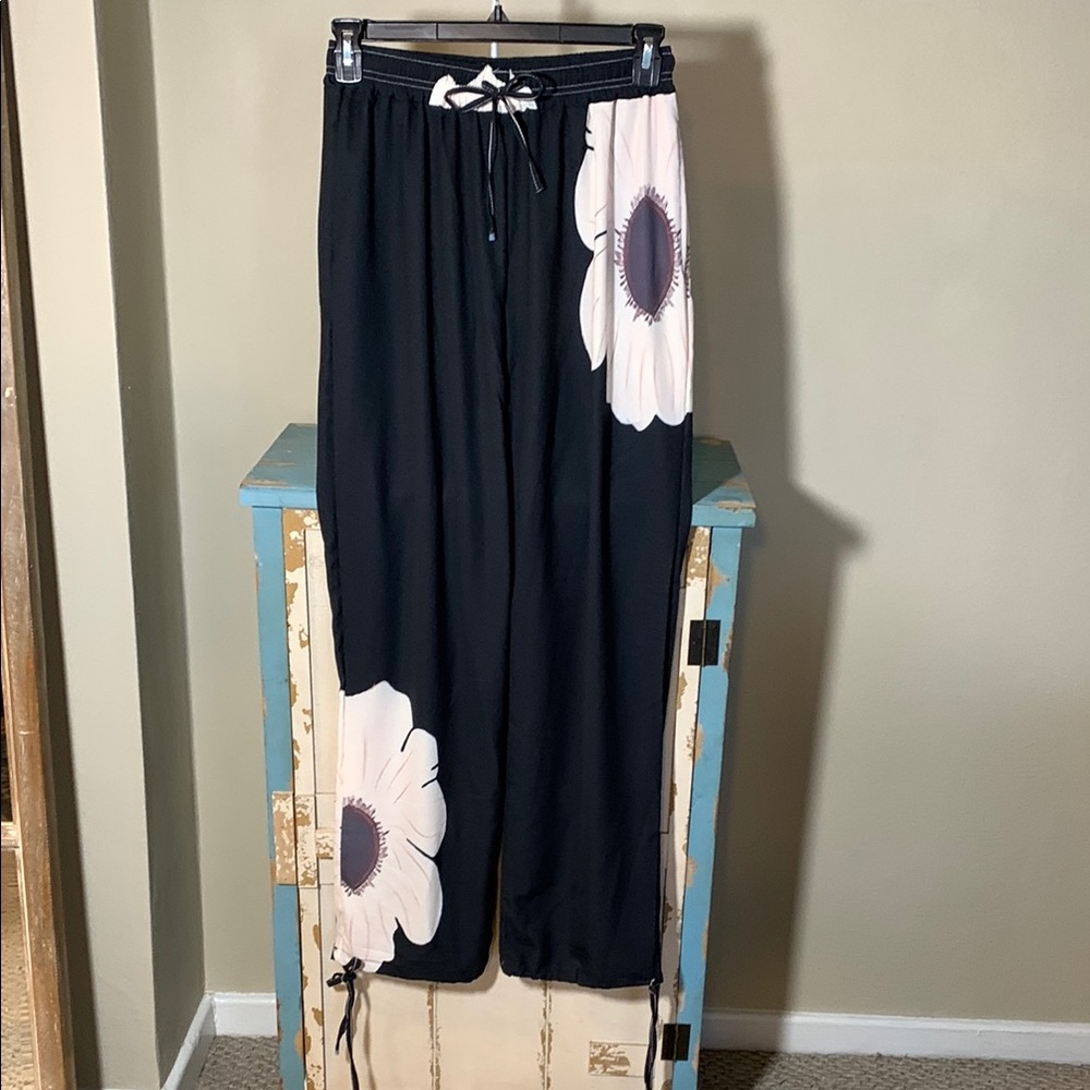 NEW!!!Black Harem Pants with White Floral Design.Size Medium
